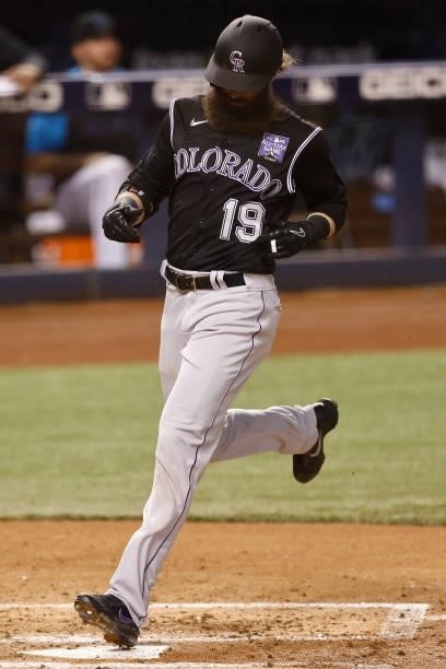 Charlie Blackmon of the Colorado Rockies scores a run during the third inning against the Miami Marlins at loanDepot park on June 09, 2021 in Miami,...