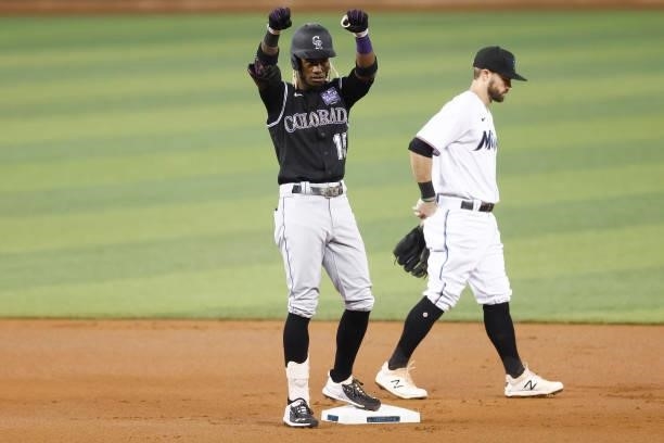 Raimel Tapia of the Colorado Rockies celebrates after hitting a double during the first inning against the Miami Marlins at loanDepot park on June...