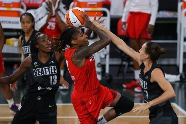 Stephanie Talbot defends as Ezi Magbegor of the Seattle Storm blocks a shot by Crystal Bradford of the Atlanta Dream in the second half at Gateway...