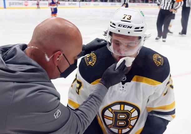 Charlie McAvoy of the Boston Bruins is cut during the first period by in Game Six of the Second Round of the 2021 NHL Stanley Cup Playoffs at the...