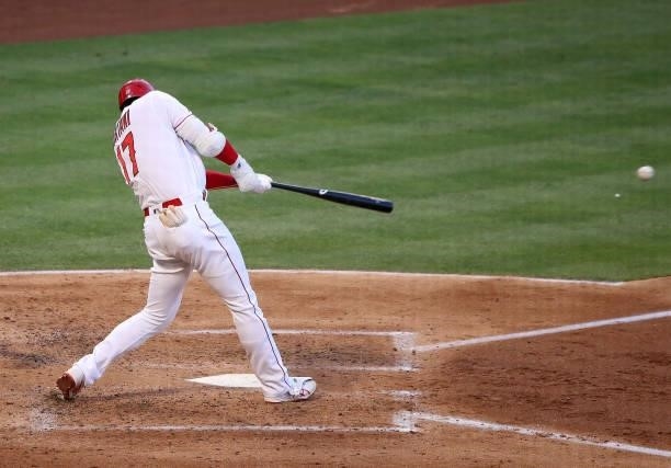 Shohei Ohtani of the Los Angeles Angels hits a single during the third inning against the Kansas City Royals at Angel Stadium of Anaheim on June 09,...