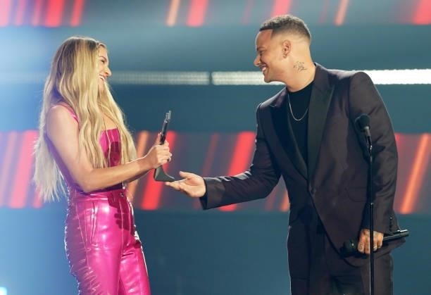 Kelsea Ballerini accepts the CMT Performance of the Year award from Kane Brown onstage for the 2021 CMT Music Awards at Bridgestone Arena on June 09,...