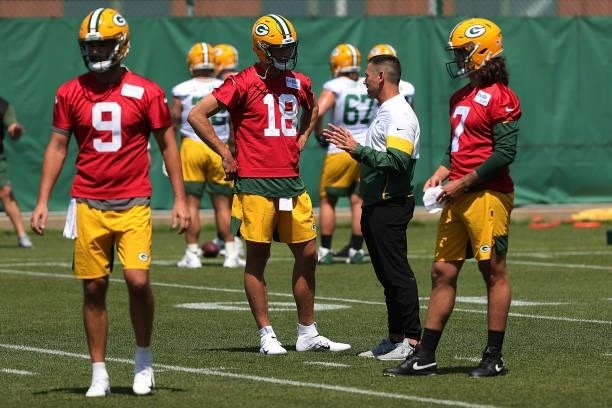 Head coach Matt LaFleur of the Green Bay Packers speaks with Jake Dolegala during training camp at Ray Nitschke Field on June 09, 2021 in...