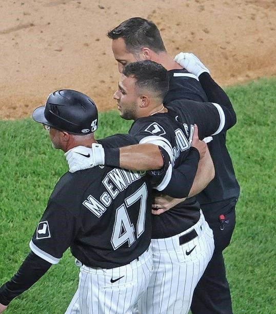 Nick Madrigal of the Chicago White Sox is helped off the field after suffering an injury in the 7th inning against the Toronto Blue Jays at...