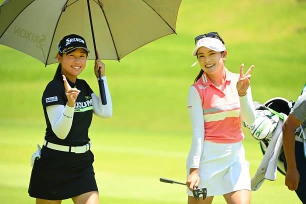 Nana Suganuma and Yui Kawamoto of Japan pose during the first round of the Ai Miyazato Suntory Ladies Open at Rokko Kokusai Golf Club on June 10,...