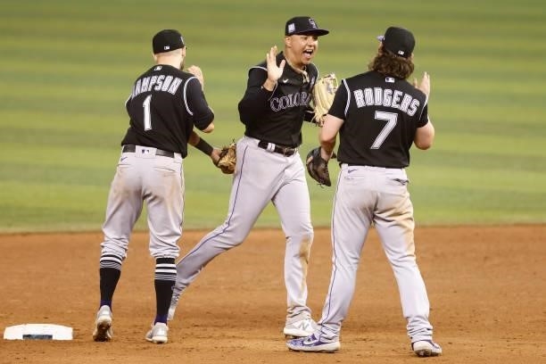 Yonathan Daza of the Colorado Rockies celebrates with teammates after defeating the Miami Marlins 4-3 at loanDepot park on June 09, 2021 in Miami,...