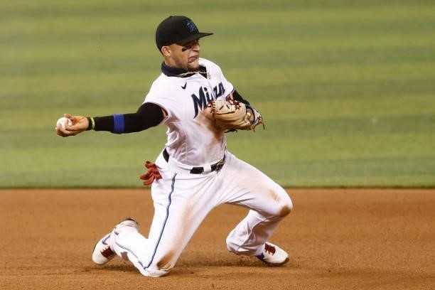 Isan Diaz of the Miami Marlins throws out a runner at second base against the Colorado Rockies at loanDepot park on June 09, 2021 in Miami, Florida.