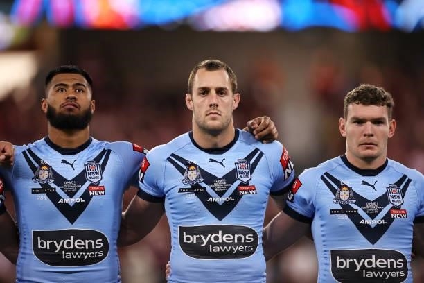 Payne Haas, Isaah Yeo and Liam Martin sing the anthem before game one of the 2021 State of Origin series between the New South Wales Blues and the...