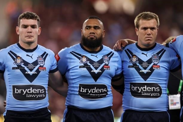 Liam Martin, Junior Paulo and Jake Trbojevic sing the anthem before game one of the 2021 State of Origin series between the New South Wales Blues and...