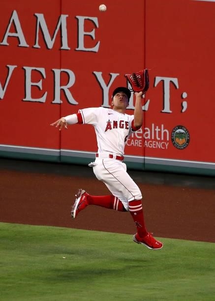 Kean Wong of the Los Angeles Angels catches the fly ball hit by Andrew Benintendi of the Kansas City Royals during the fifth inning at Angel Stadium...