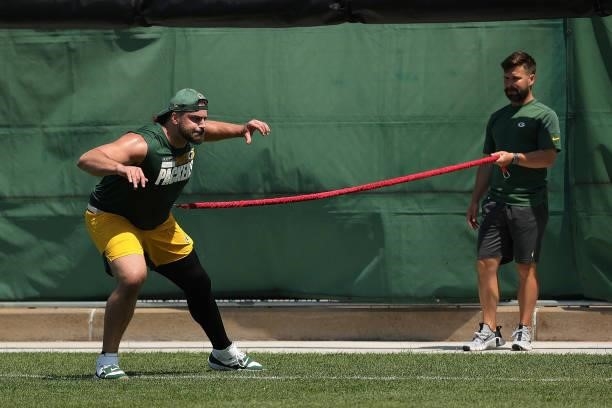 David Bahktiari of the Green Bay Packers works out during training camp at Ray Nitschke Field on June 09, 2021 in Ashwaubenon, Wisconsin.