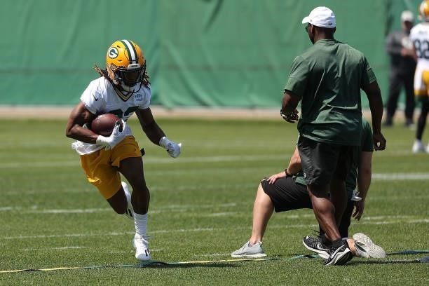 Aaron Jones of the Green Bay Packers works out during training camp at Ray Nitschke Field on June 09, 2021 in Ashwaubenon, Wisconsin.