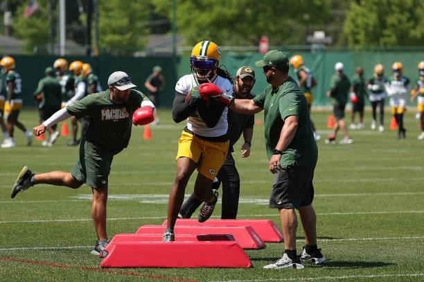 Davante Adams of the Green Bay Packers works out during training camp at Ray Nitschke Field on June 09, 2021 in Ashwaubenon, Wisconsin.