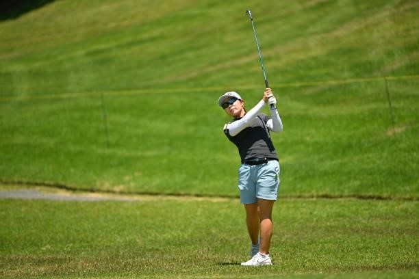 Mamiko Higa of Japan hits her second shot on the 8th hole during the first round of the Ai Miyazato Suntory Ladies Open at Rokko Kokusai Golf Club on...