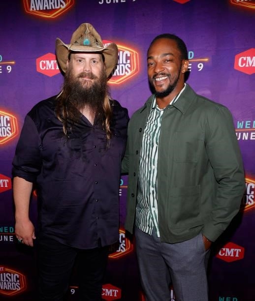 Chris Stapleton and Anthony Mackie attend the 2021 CMT Music Awards at Bridgestone Arena on June 09, 2021 in Nashville, Tennessee.