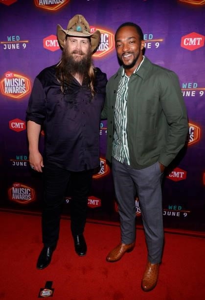 Chris Stapleton and Anthony Mackie attend the 2021 CMT Music Awards at Bridgestone Arena on June 09, 2021 in Nashville, Tennessee.