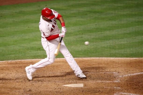 Juan Lagares of the Los Angeles Angels hits an RBI sacrifice groundout to score in Max Stassi during the eighth inning against the Kansas City Royals...