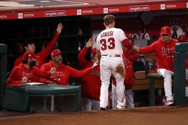 Max Stassi of the Los Angeles Angels celebrates his run scored with the dugout during the eighth inning against the Kansas City Royals at Angel...