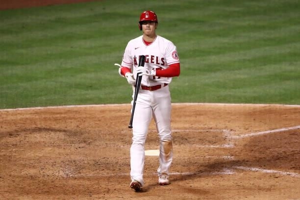 Shohei Ohtani of the Los Angeles Angels looks on during his at bat during the seventh inning against the Kansas City Royals at Angel Stadium of...