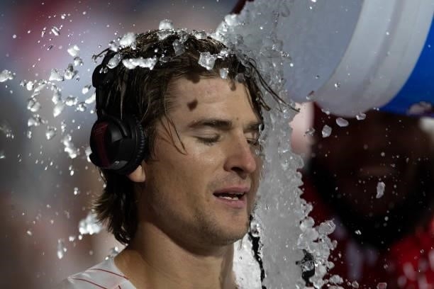 Luke Williams of the Philadelphia Phillies has ice water poured on him after hitting a walk-off two run home run in the bottom of the ninth inning...