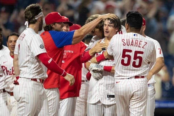 Luke Williams of the Philadelphia Phillies celebrates with teammates after hitting a walk-off two run home run in the bottom of the ninth inning...