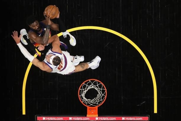 Deandre Ayton of the Phoenix Suns attempts a shot over Aaron Gordon of the Denver Nuggets during the first half in Game Two of the Western Conference...