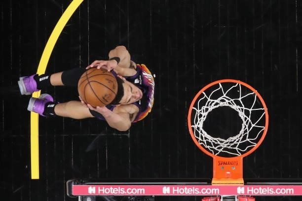 Devin Booker of the Phoenix Suns slam dunks the ball against the Denver Nuggets during the first half in Game Two of the Western Conference...