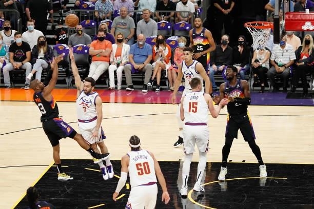 Chris Paul of the Phoenix Suns puts up a shot over Facundo Campazzo of the Denver Nuggets during the first half in Game Two of the Western Conference...