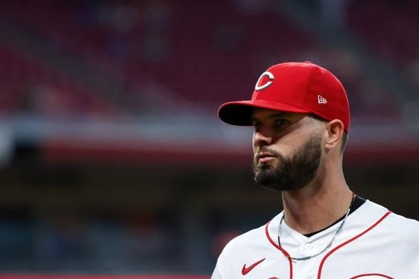 Jesse Winker of the Cincinnati Reds walks across the field in the fifth inning against the Milwaukee Brewers at Great American Ball Park on June 09,...