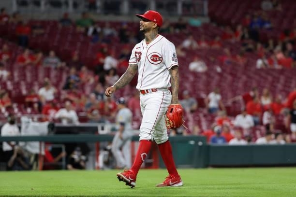Vladimir Gutierrez of the Cincinnati Reds walks off the field in the sixth inning against the Milwaukee Brewers at Great American Ball Park on June...