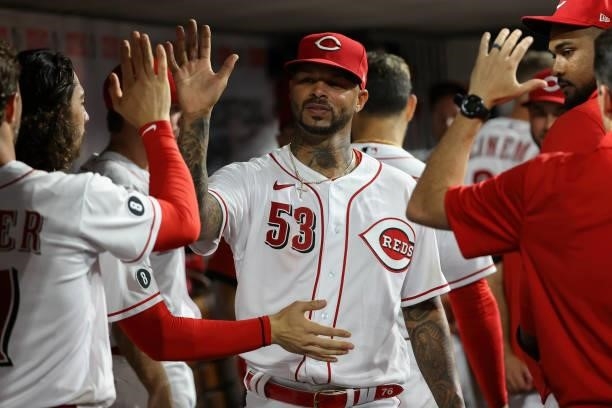 Vladimir Gutierrez of the Cincinnati Reds celebrates with teammates in the seventh inning against the Milwaukee Brewers at Great American Ball Park...