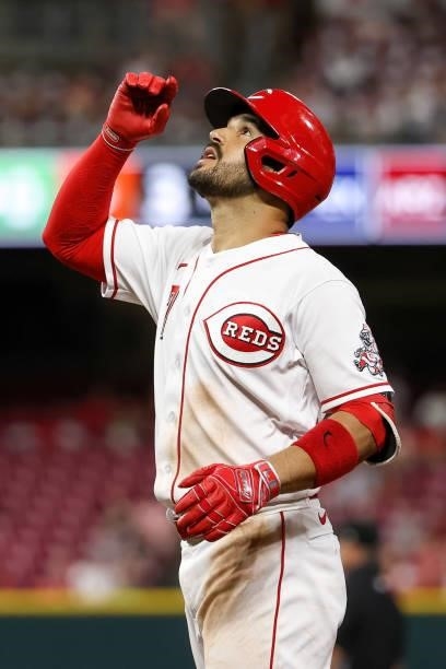 Eugenio Suarez of the Cincinnati Reds celebrates after hitting a single in the seventh inning against the Milwaukee Brewers at Great American Ball...