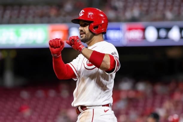 Eugenio Suarez of the Cincinnati Reds celebrates after hitting a single in the seventh inning against the Milwaukee Brewers at Great American Ball...