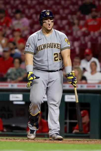 Daniel Vogelbach of the Milwaukee Brewers reacts to a pitch in the ninth inning against the Cincinnati Reds at Great American Ball Park on June 09,...