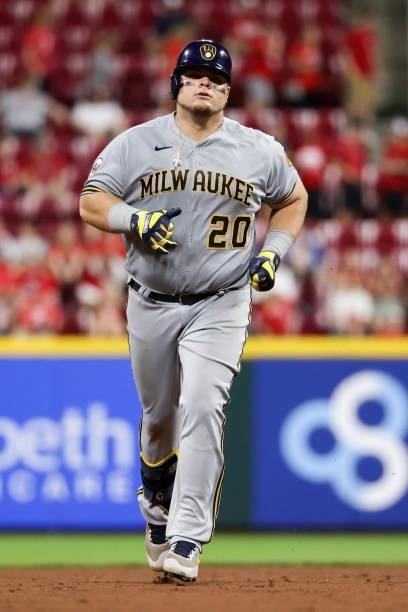 Daniel Vogelbach of the Milwaukee Brewers rounds the bases after hitting a home run in the ninth inning against the Cincinnati Reds at Great American...
