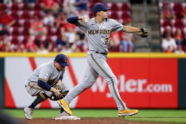 Willy Adames of the Milwaukee Brewers throws to first base in the eighth inning against the Cincinnati Reds at Great American Ball Park on June 09,...
