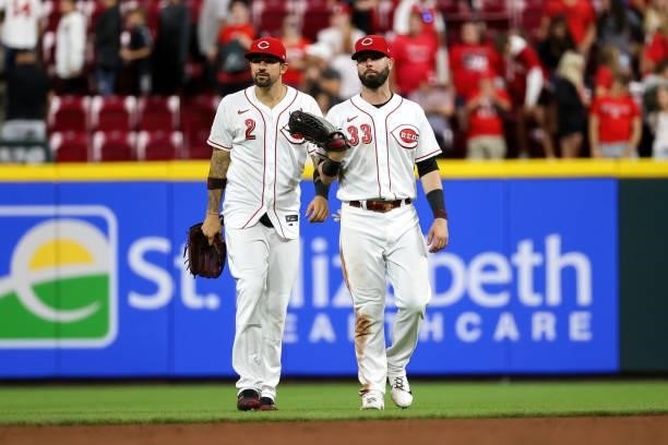 Nick Castellanos and Jesse Winker of the Cincinnati Reds celebrate after beating the Milwaukee Brewers 7-3 at Great American Ball Park on June 09,...