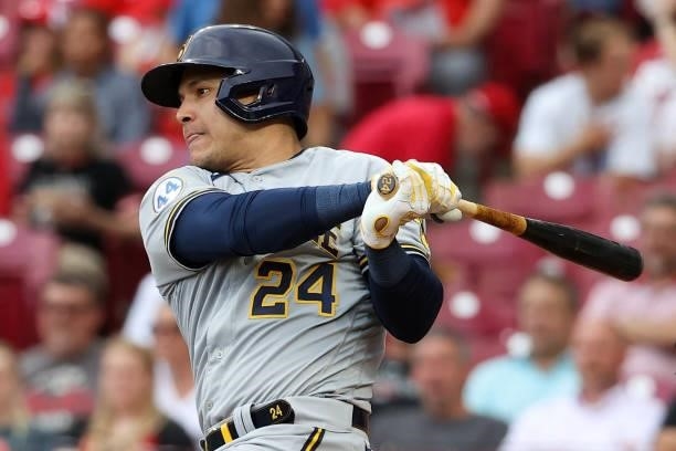 Avisail Garcia of the Milwaukee Brewers hits a single in the first inning against the Cincinnati Reds at Great American Ball Park on June 09, 2021 in...