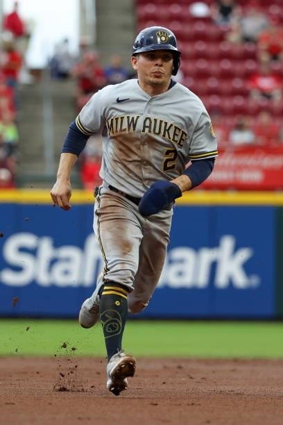 Luis Urias of the Milwaukee Brewers runs to third base in the first inning against the Cincinnati Reds at Great American Ball Park on June 09, 2021...
