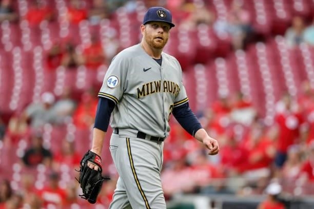 Brett Anderson of the Milwaukee Brewers walks off the field after the first inning against the Cincinnati Reds at Great American Ball Park on June...