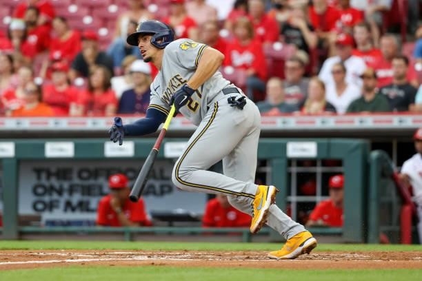 Willy Adames of the Milwaukee Brewers hits a single in the second inning against the Cincinnati Reds at Great American Ball Park on June 09, 2021 in...