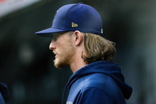 Josh Hader of the Milwaukee Brewers looks on from the dugout in the second inning against the Cincinnati Reds at Great American Ball Park on June 09,...