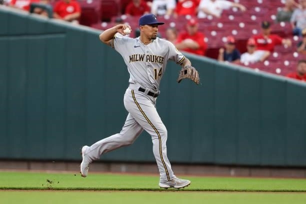 Jace Peterson of the Milwaukee Brewers throws to first base in the third inning against the Cincinnati Reds at Great American Ball Park on June 09,...
