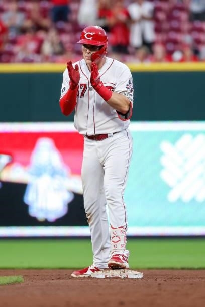 Tyler Stephenson of the Cincinnati Reds celebrates after hitting a double in the fourth inning against the Milwaukee Brewers at Great American Ball...