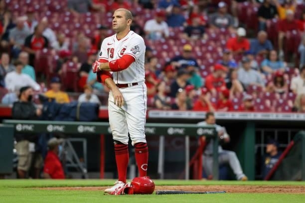 Joey Votto of the Cincinnati Reds reacts after striking out in the fourth inning against the Milwaukee Brewers at Great American Ball Park on June...