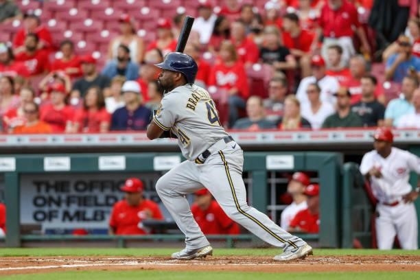 Jackie Bradley Jr. #41 of the Milwaukee Brewers hits a single in the second inning against the Cincinnati Reds at Great American Ball Park on June...