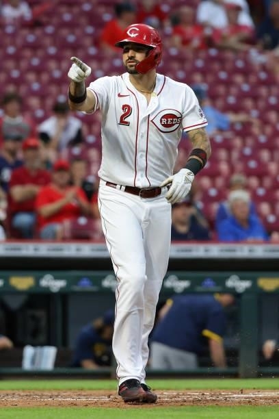 Nick Castellanos of the Cincinnati Reds reacts after drawing a walk in the fourth inning against the Milwaukee Brewers at Great American Ball Park on...