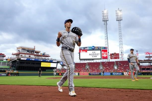 Christian Yelich of the Milwaukee Brewers walks across the field in the third inning against the Cincinnati Reds at Great American Ball Park on June...