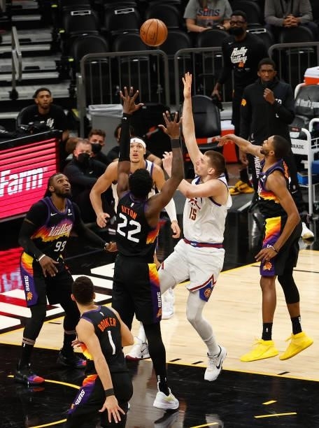 Nikola Jokic of the Denver Nuggets puts up a shot over Deandre Ayton of the Phoenix Suns during the second half in Game Two of the Western Conference...