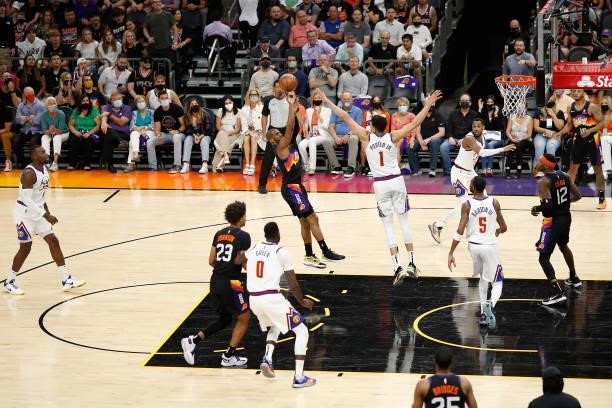Chris Paul of the Phoenix Suns puts up a shot over Michael Porter Jr. #1 of the Denver Nuggets during the first half in Game Two of the Western...